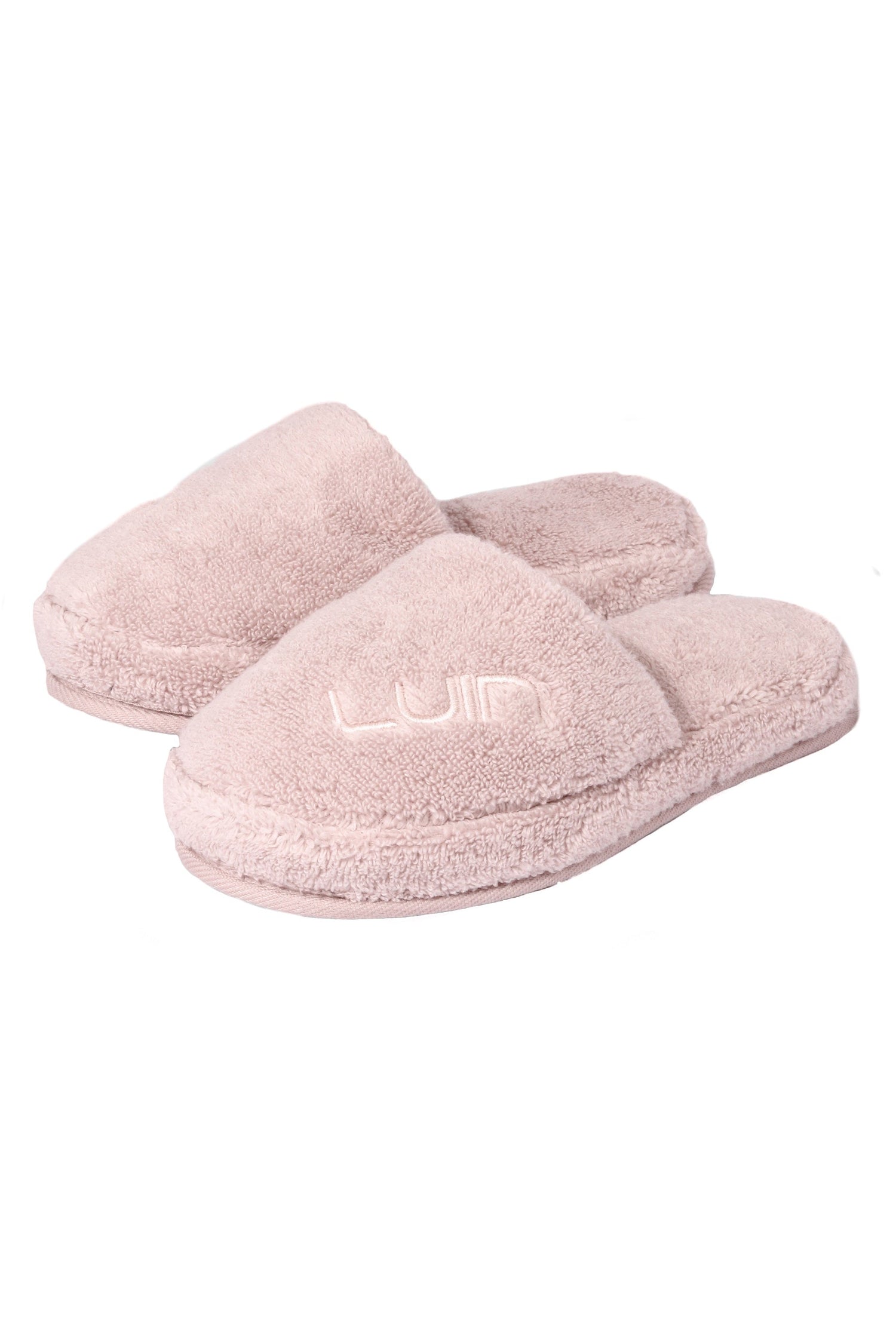 Pair of pink slippers on a white background