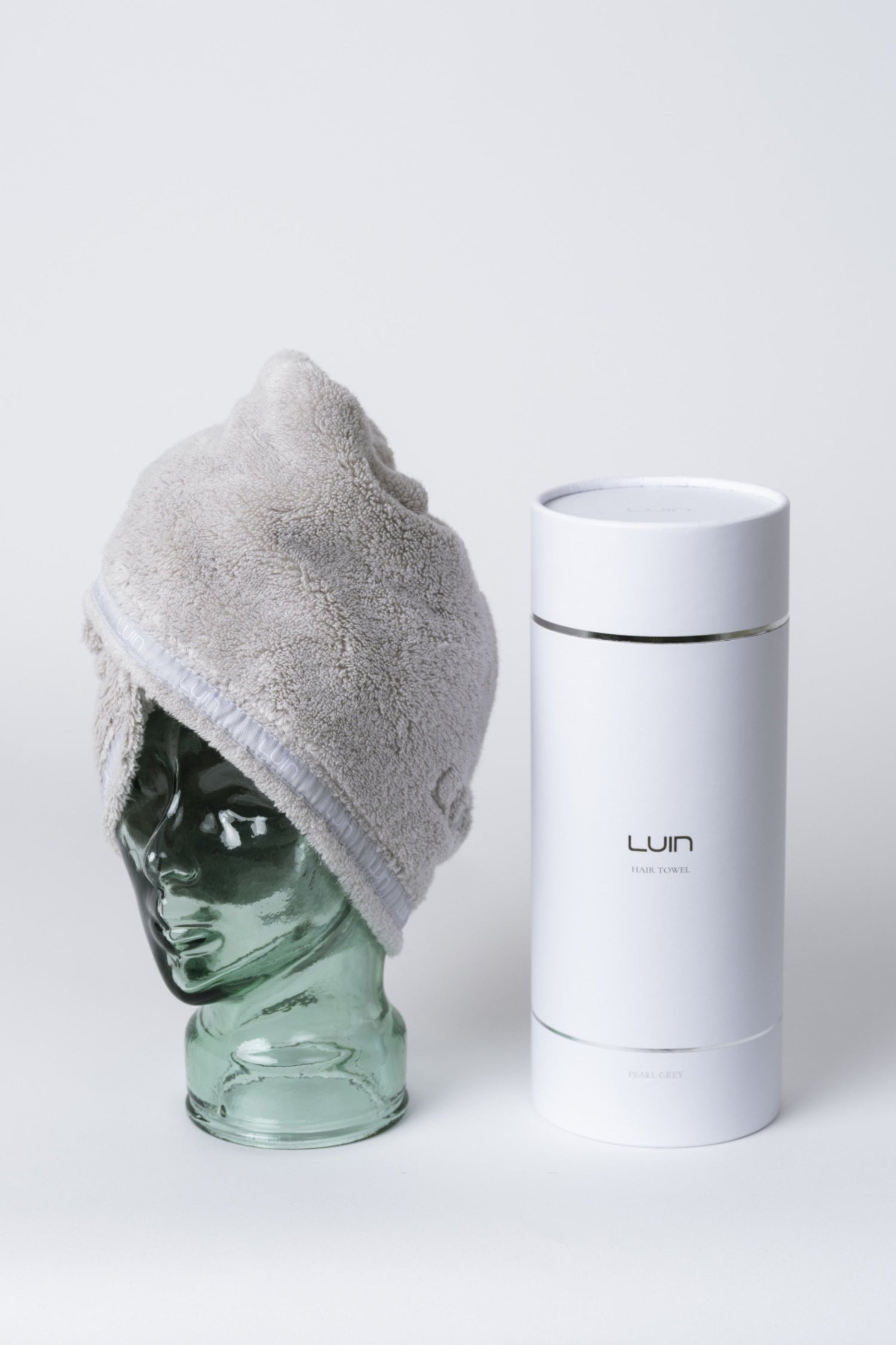 Pearl grey hair towel shown with its Luin gift box