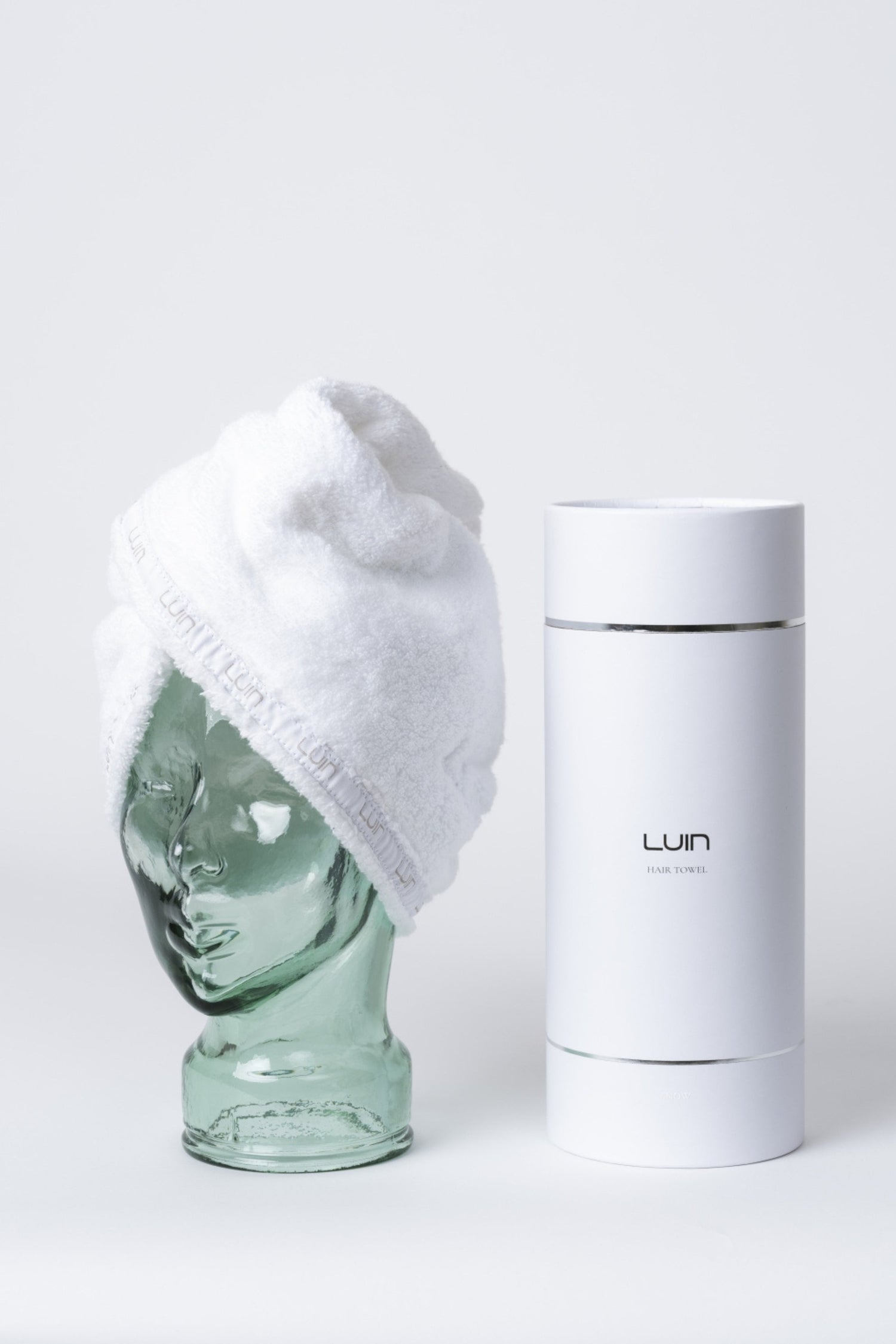 Snow white hair towel shown with its Luin gift box