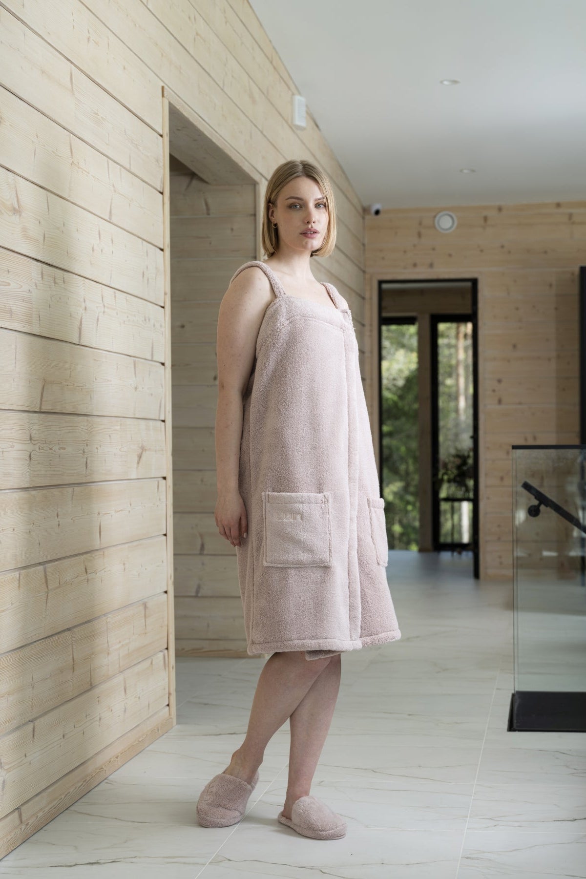 Dusty rose spa dress in a calm bathroom setting