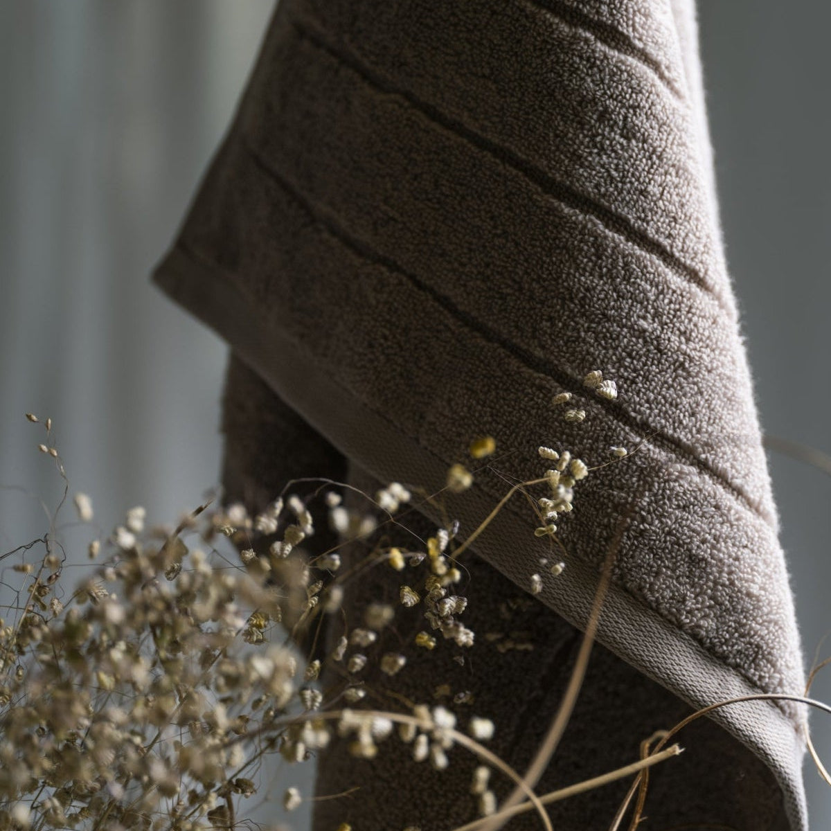 Sandstone hand towel in a calm bathroom setting