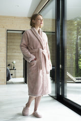 Detail of the soft cotton of the dusty rose bathrobe